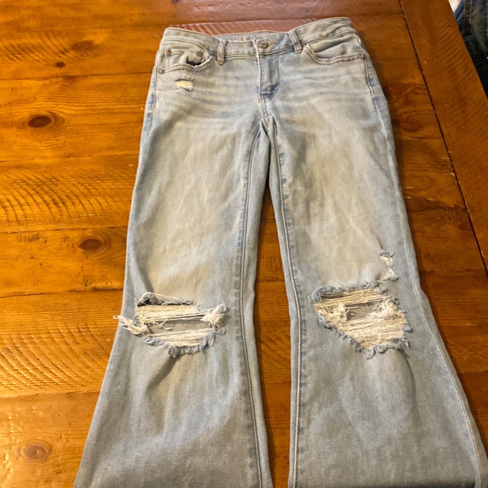 American Eagle 00 Regular pants with rips in knees and pockets low rise flare